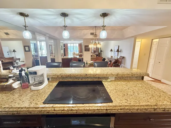 a bedroom with a bed a dresser and chair