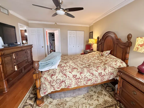 a bath room with a toilet a bath tub and a shower curtain