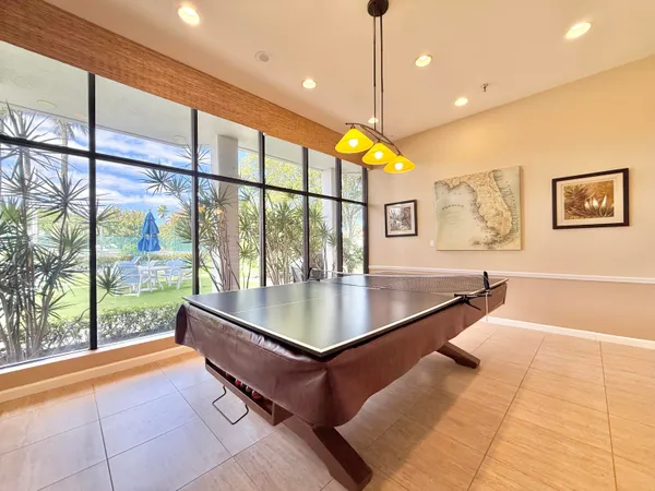 a kitchen with stainless steel appliances granite countertop a refrigerator a stove top oven a sink and cabinets