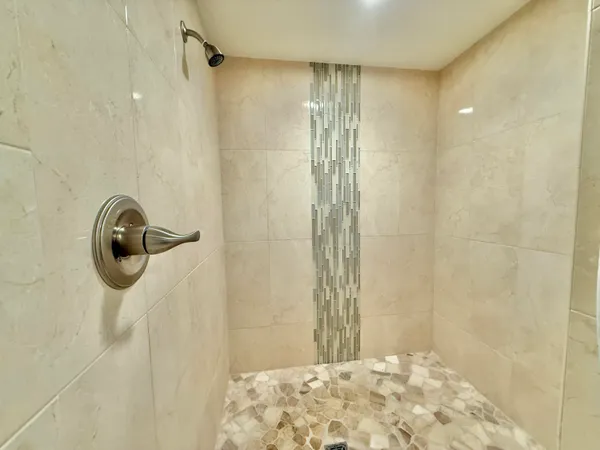 a view of a room with a window and a shower curtain