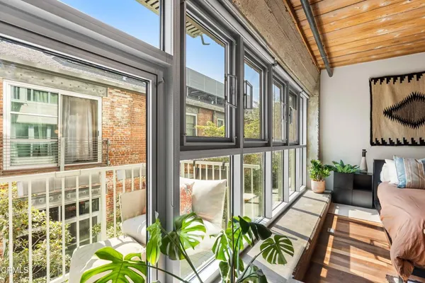 a view of balcony with furniture
