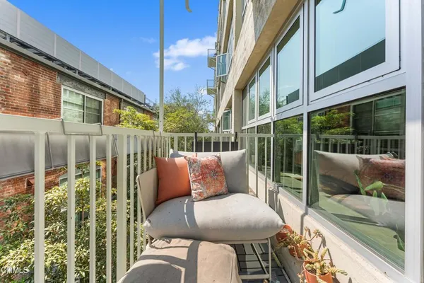 a view of balcony with furniture