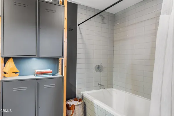 a bathroom with a bathtub and a sink