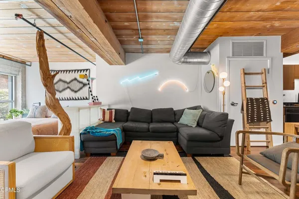 a living room with furniture and a window