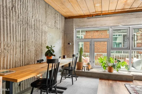 a view of a dining room with furniture window and wooden floor