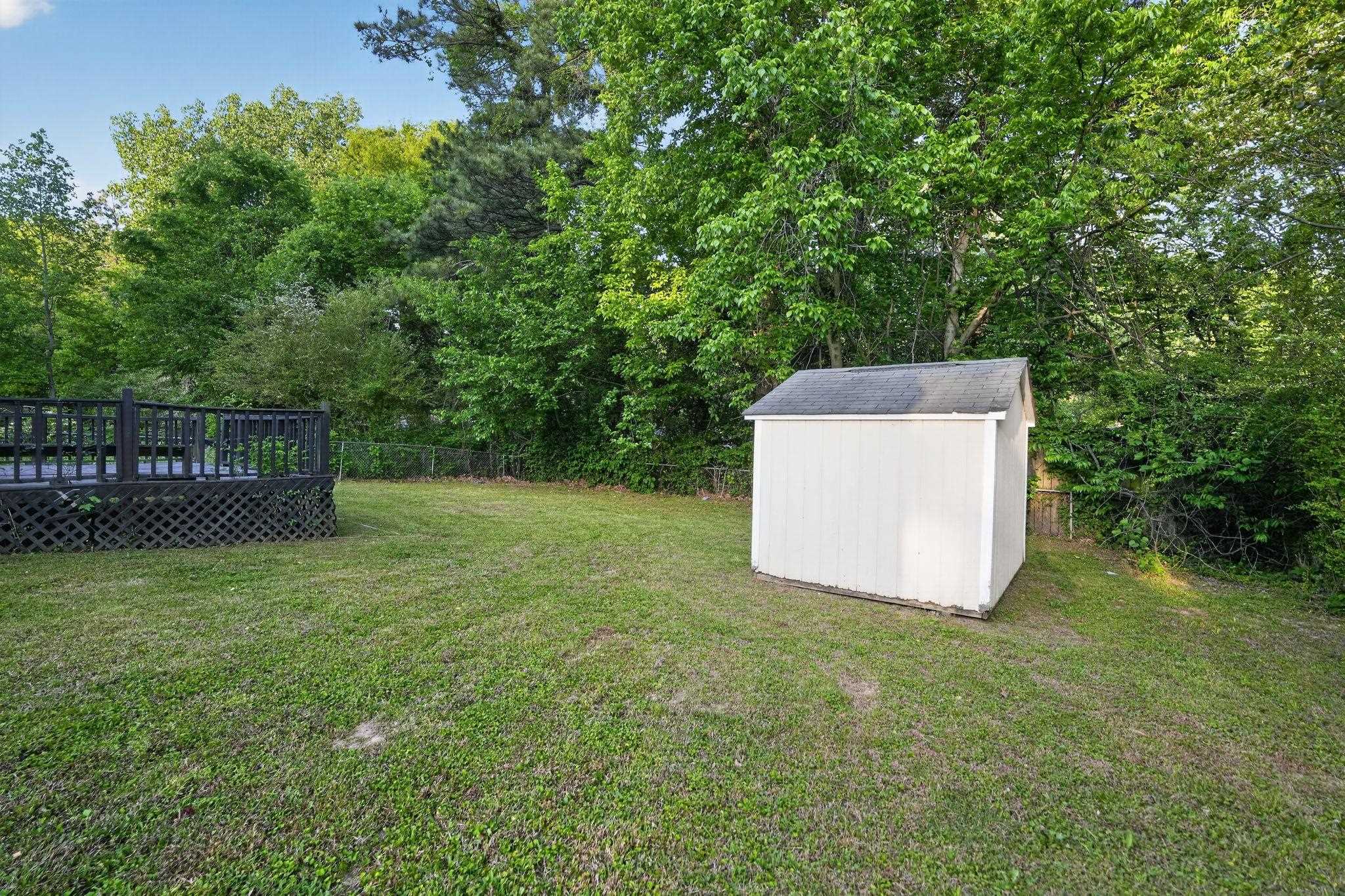 3603 England Street Memphis, TN 38127 - Photo 6 of 36 Fenced backyard featuring a storage shed and a deck