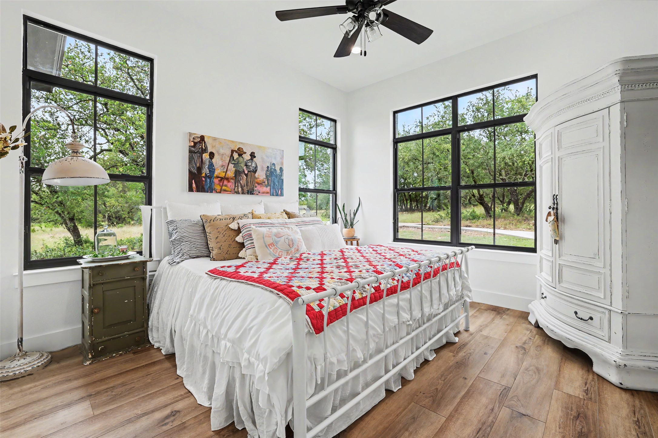 7670 Shiny Top Ranch Lane Salado, TX 76571 - Photo 26 of 40 a bedroom with a large bed and a large window