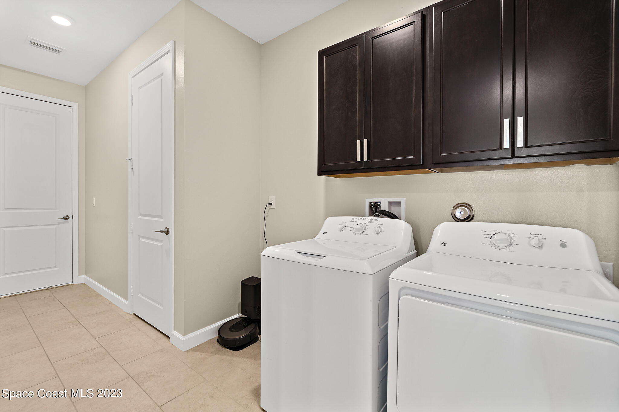 9753 Alister Drive Melbourne, FL 32940 - Photo 18 of 42 a utility room with dryer and washer