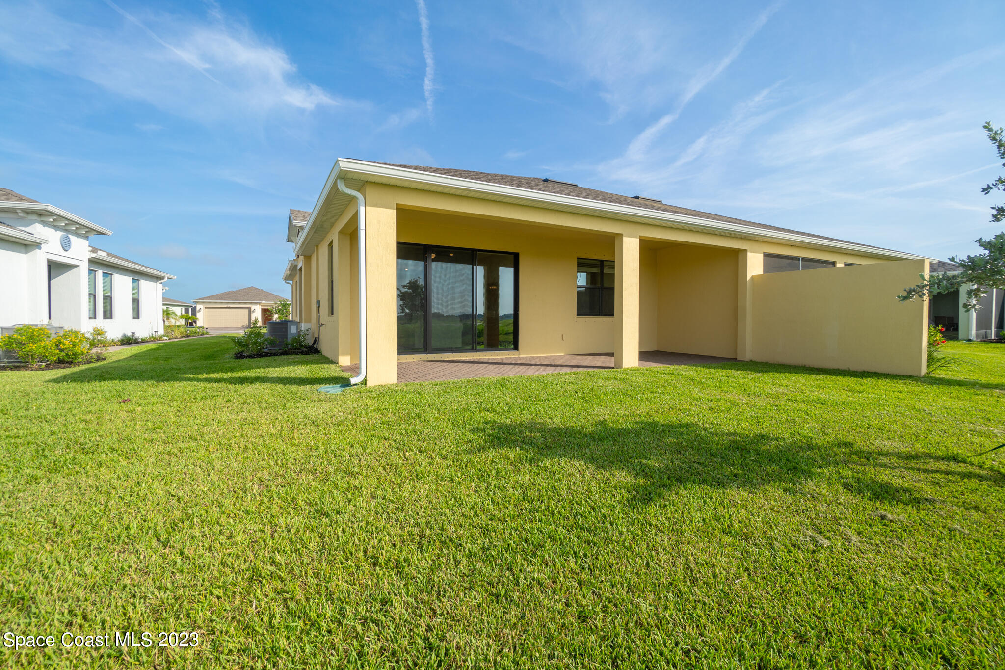 9753 Alister Drive Melbourne, FL 32940 - Photo 20 of 42 a view of a house with backyard