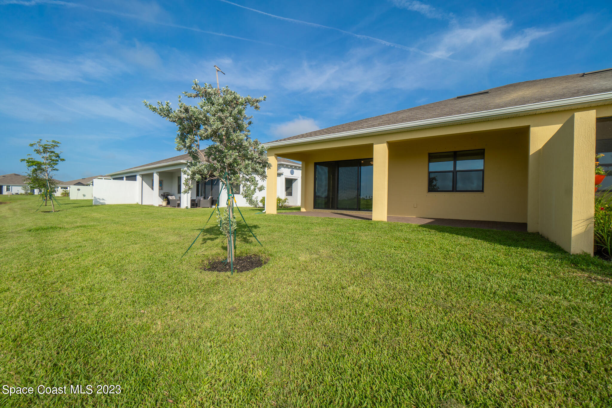 9753 Alister Drive Melbourne, FL 32940 - Photo 21 of 42 a house view with a garden space