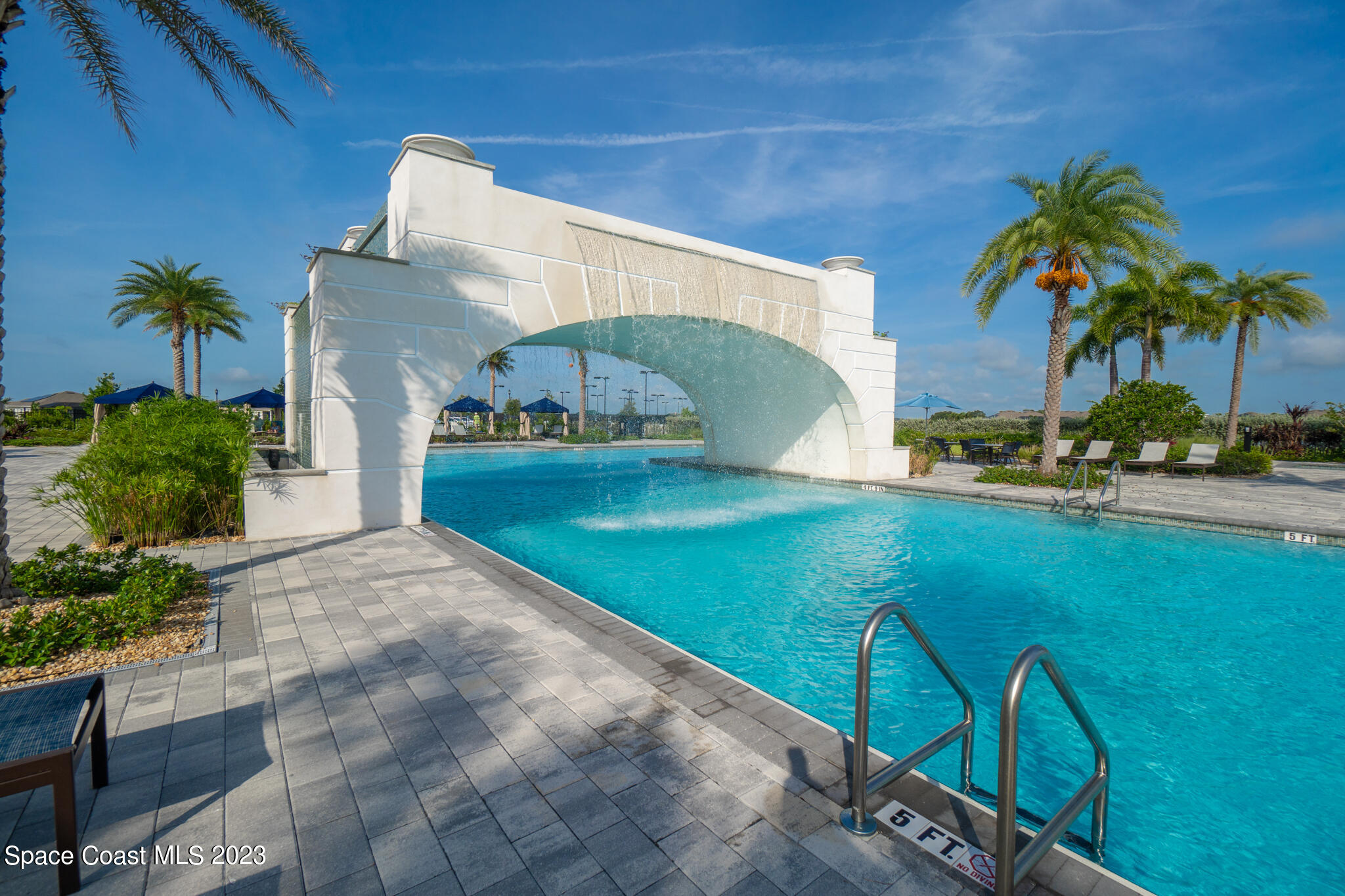 9753 Alister Drive Melbourne, FL 32940 - Photo 24 of 42 a front view of a house with garden