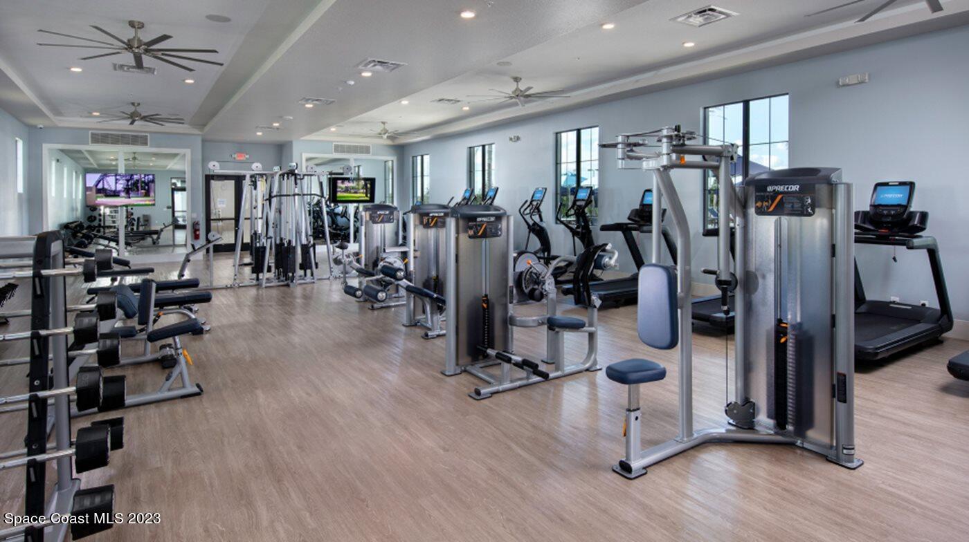 9753 Alister Drive Melbourne, FL 32940 - Photo 27 of 42 a view of a room with gym equipment