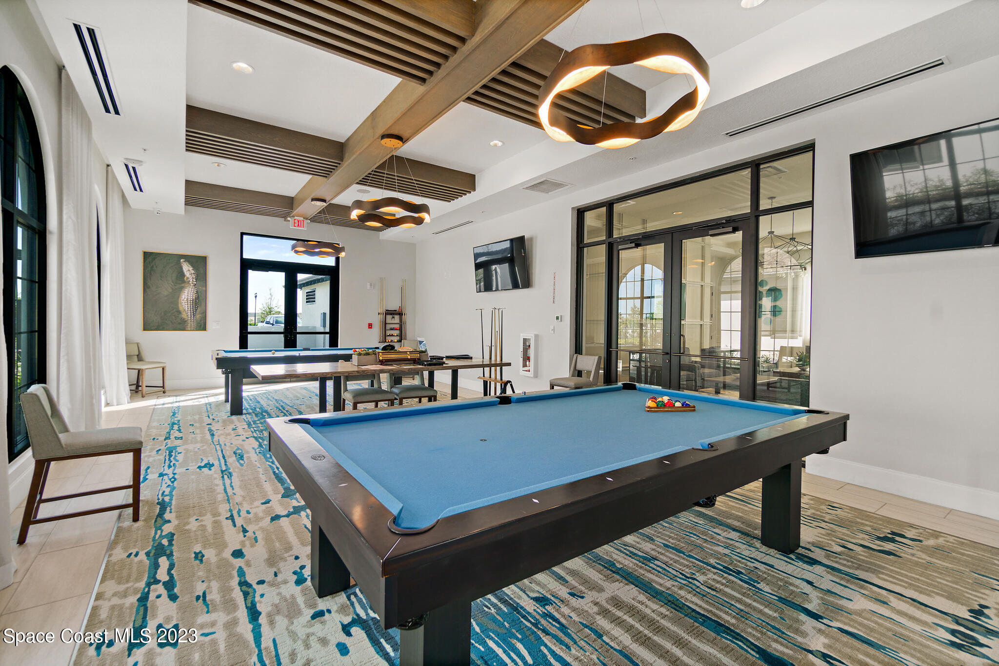 9753 Alister Drive Melbourne, FL 32940 - Photo 34 of 42 a room with pool table and windows