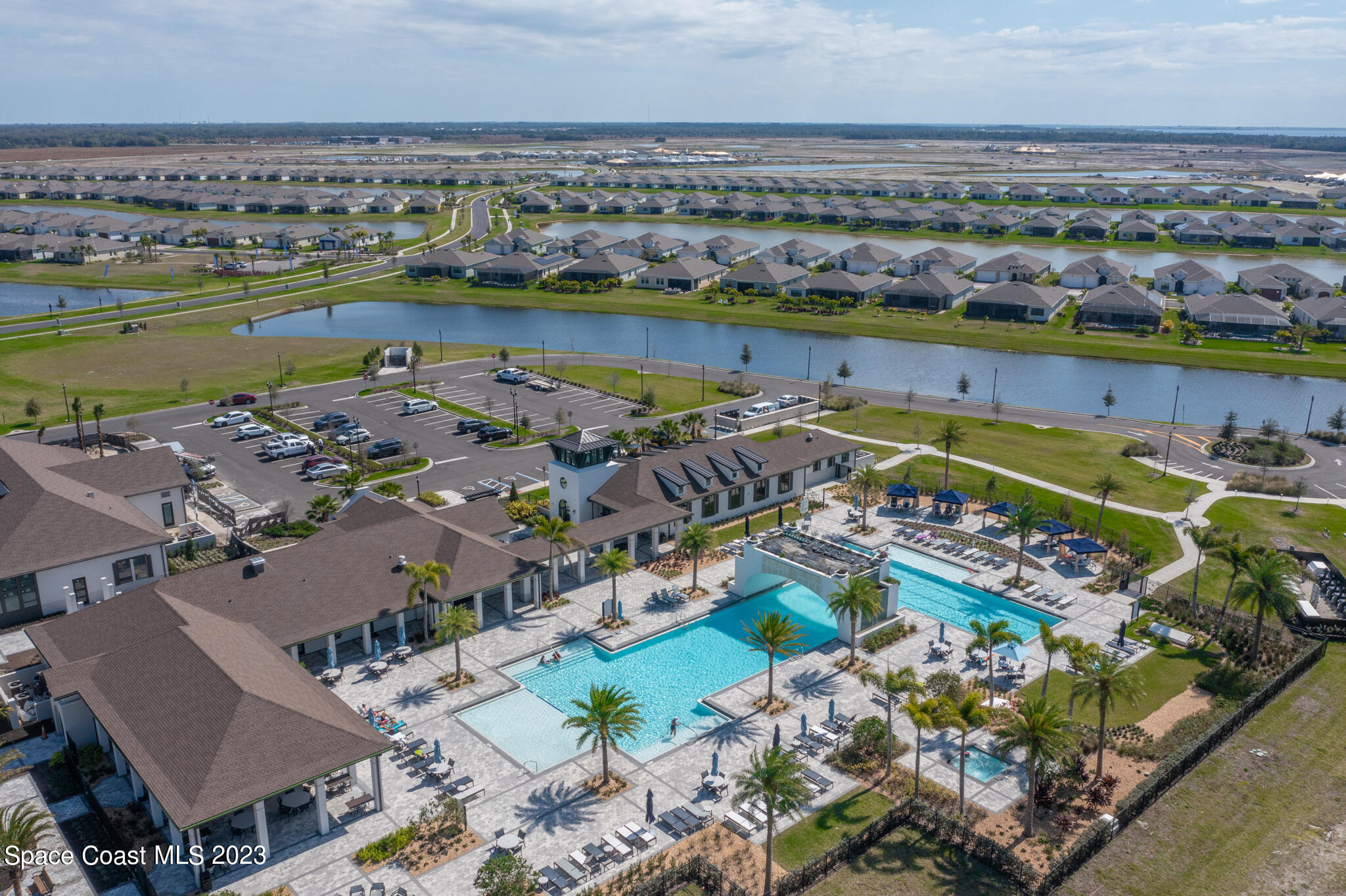 9753 Alister Drive Melbourne, FL 32940 - Photo 39 of 42 an aerial view of a city with lawn chairs