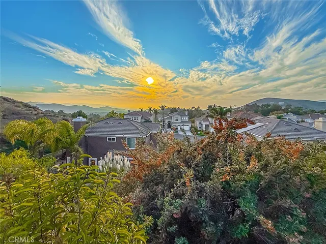 a view of a house with a yard and garage