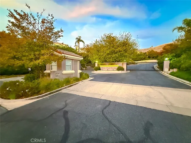 a view of empty room with a fireplace and window