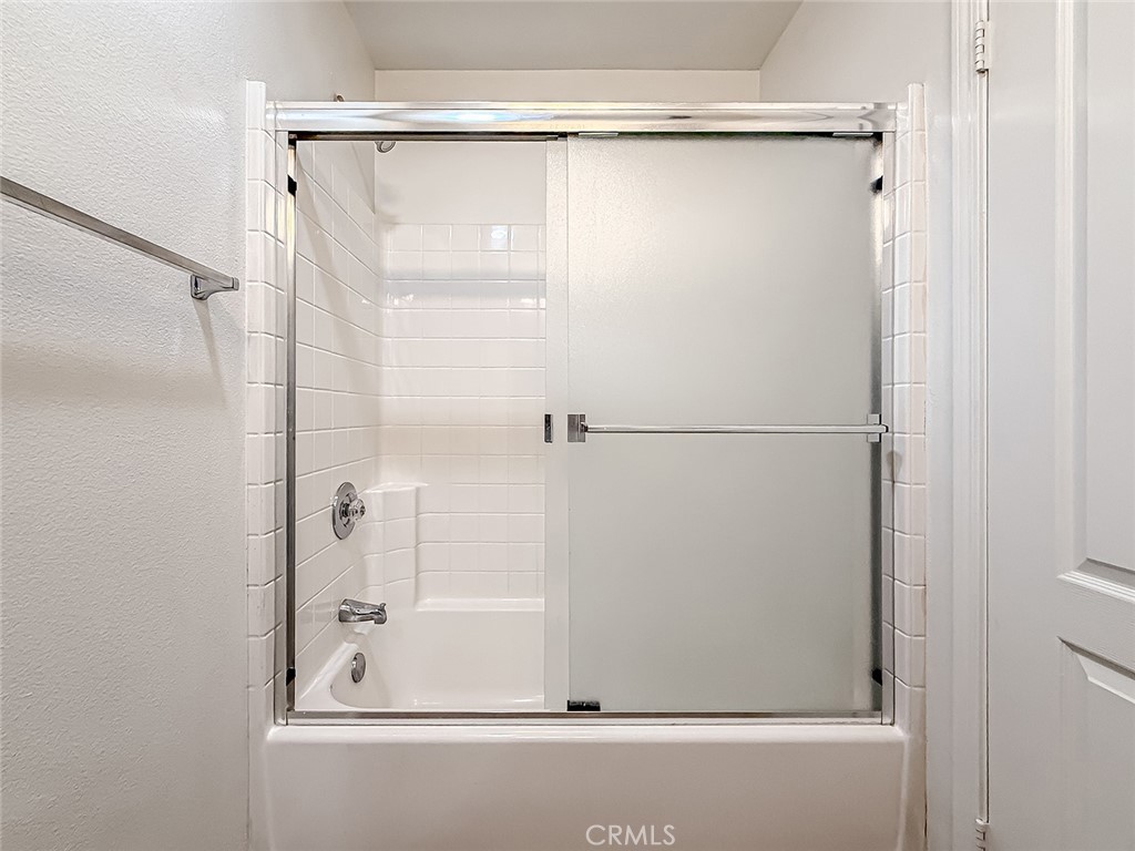 5789 Tonopah Court Simi Valley, CA 93063 - Photo 42 of 75 a bathroom with a glass shower door