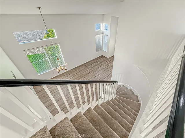 a bathroom with a glass shower door and a mirror