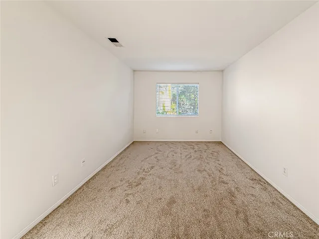 a white bath tub sitting in a bathroom next to a window
