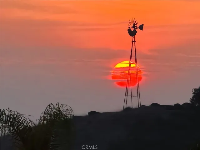 an aerial view of residential house and sandy dunes