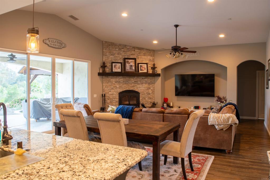 2521 Ralls Street Fallbrook, CA 92028 - Photo 15 of 43 a living room with furniture fireplace and flat screen tv