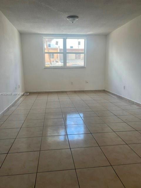 666 West 81st Street, Unit 103 Hialeah, FL 33014 - Photo 3 of 12 a view of an empty room with a window