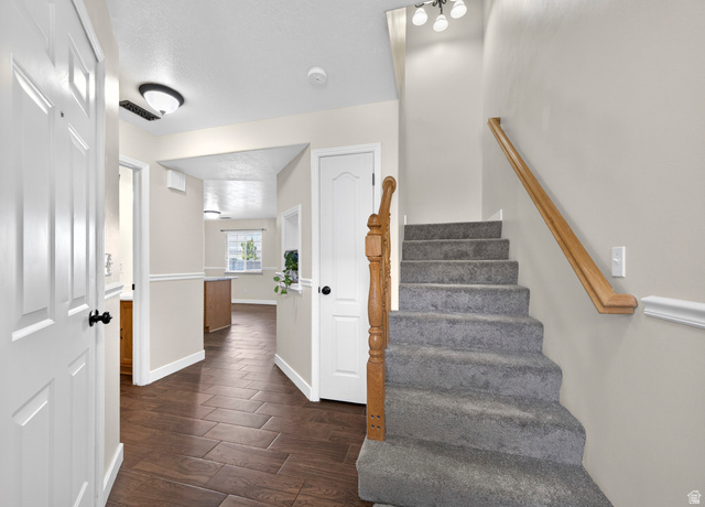 802 Sugar Maple Court Payson, UT 84651 - Photo 12 of 30 Staircase featuring wood finished floors and baseboards