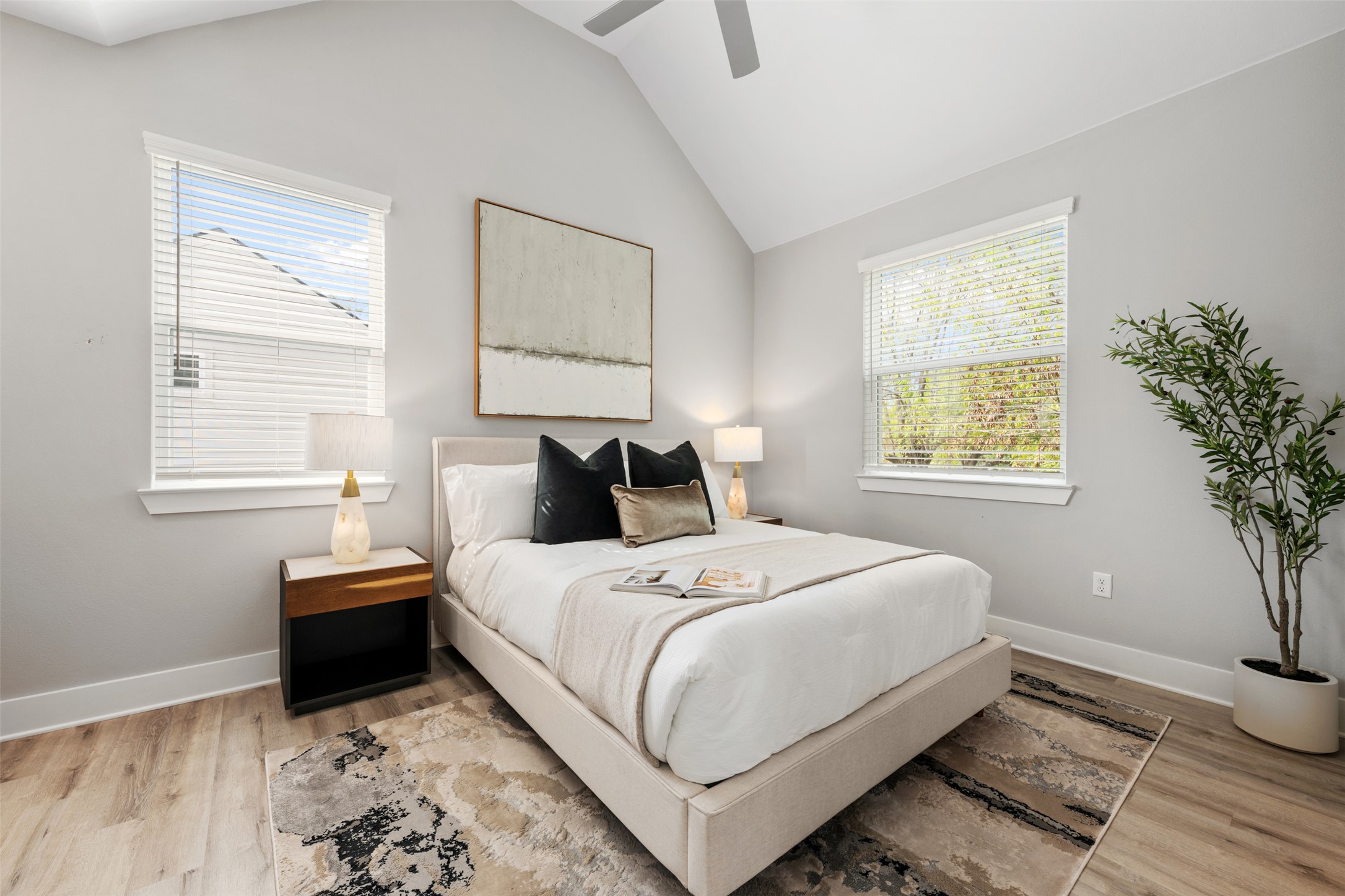 1104 Begonia Terrace, Unit 2 Austin, TX 78741 - Photo 12 of 20 a bedroom with a bed and a window