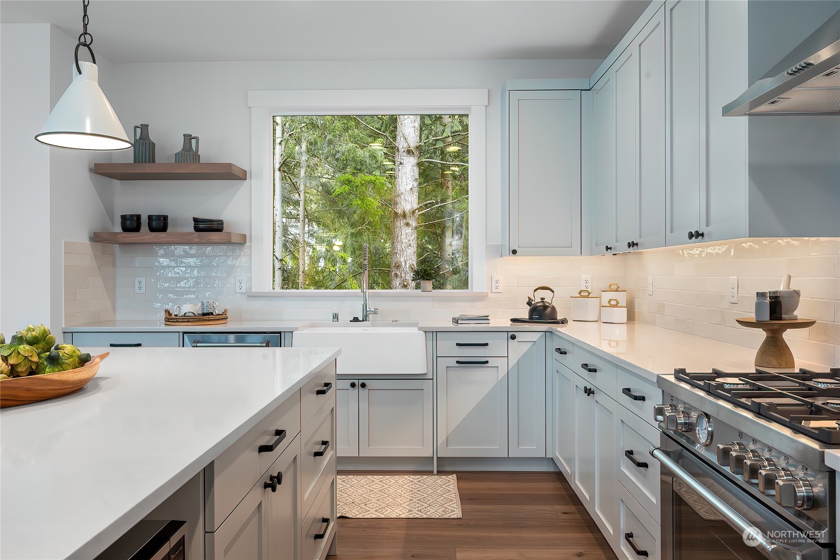 309 174th Street Southeast Bothell, WA 98012 - Photo 11 of 35 a kitchen with a sink stove top oven and cabinets