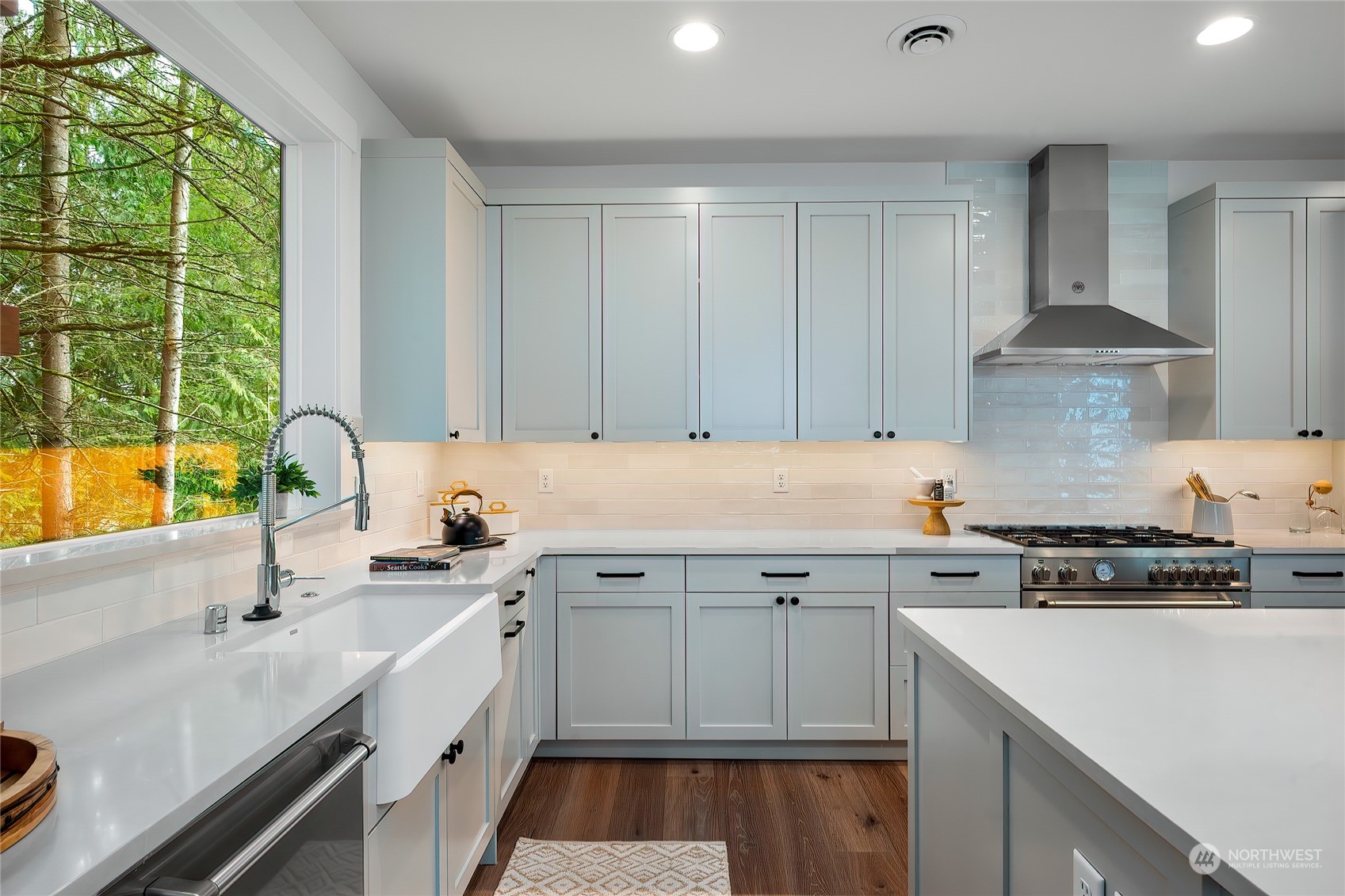 309 174th Street Southeast Bothell, WA 98012 - Photo 13 of 35 a kitchen with a sink stove and cabinets