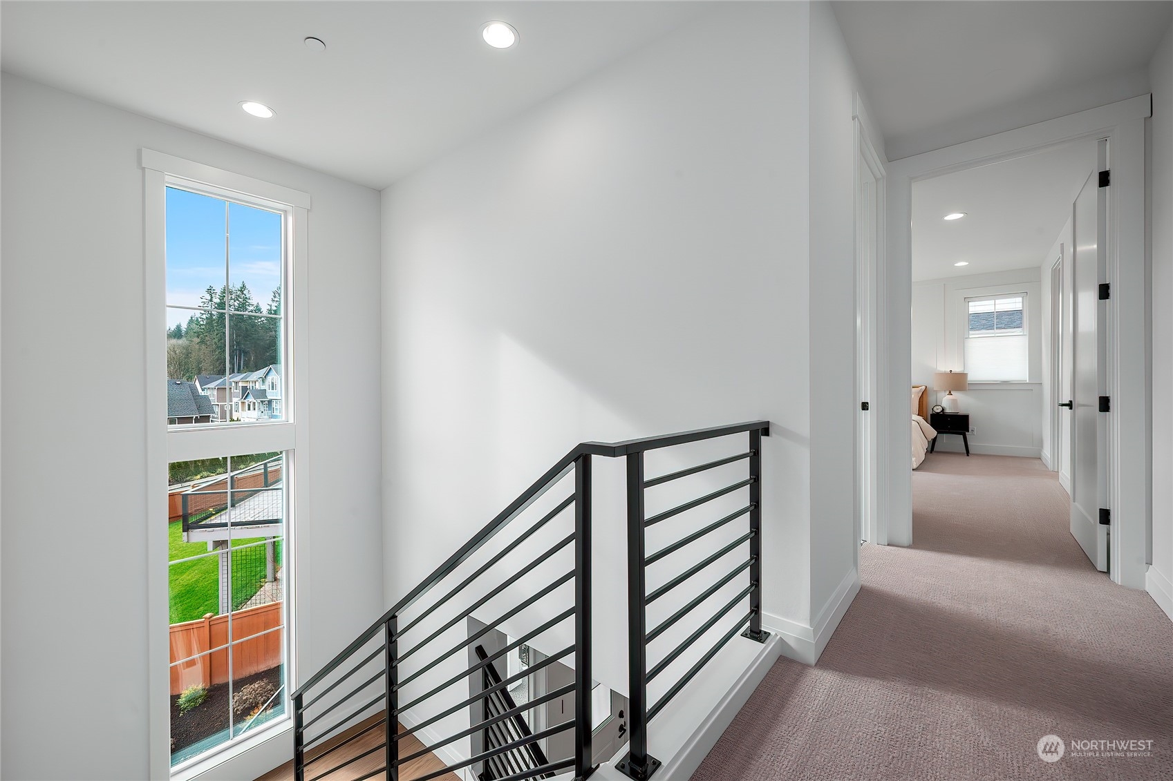 309 174th Street Southeast Bothell, WA 98012 - Photo 22 of 35 a view of a hallway with furniture and floor to ceiling window