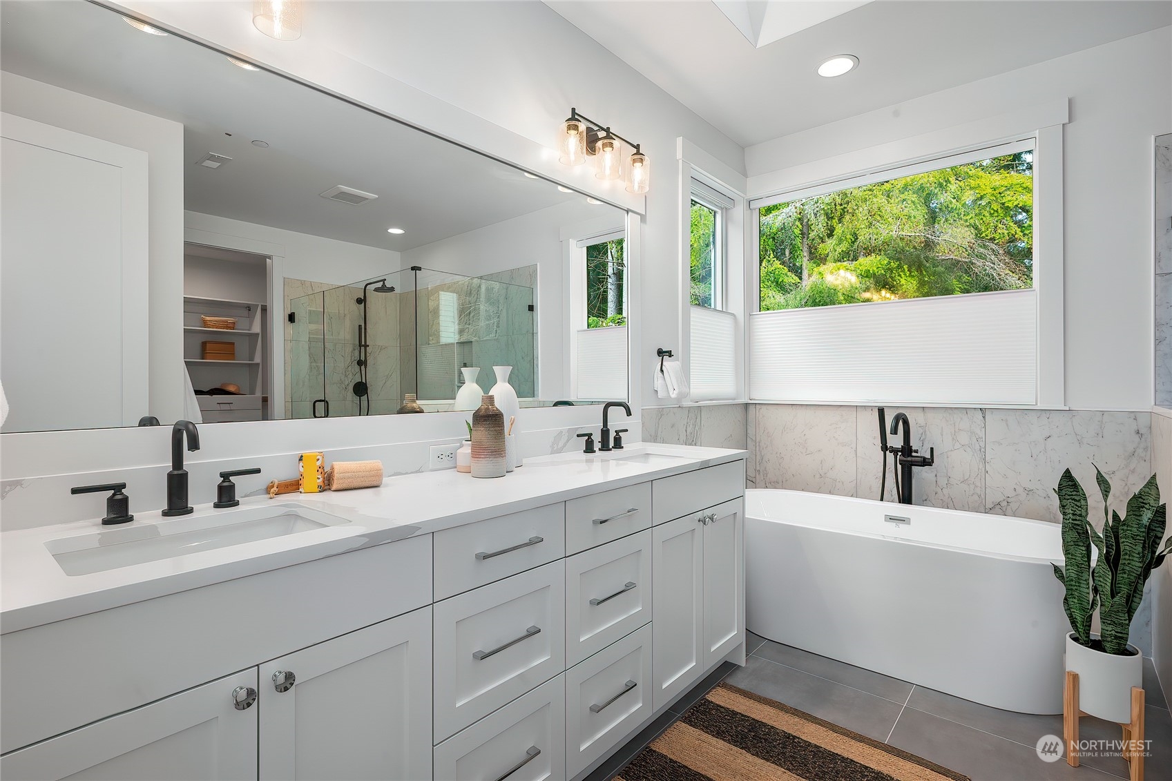 309 174th Street Southeast Bothell, WA 98012 - Photo 26 of 35 a bathroom with a double vanity sink a mirror and a window