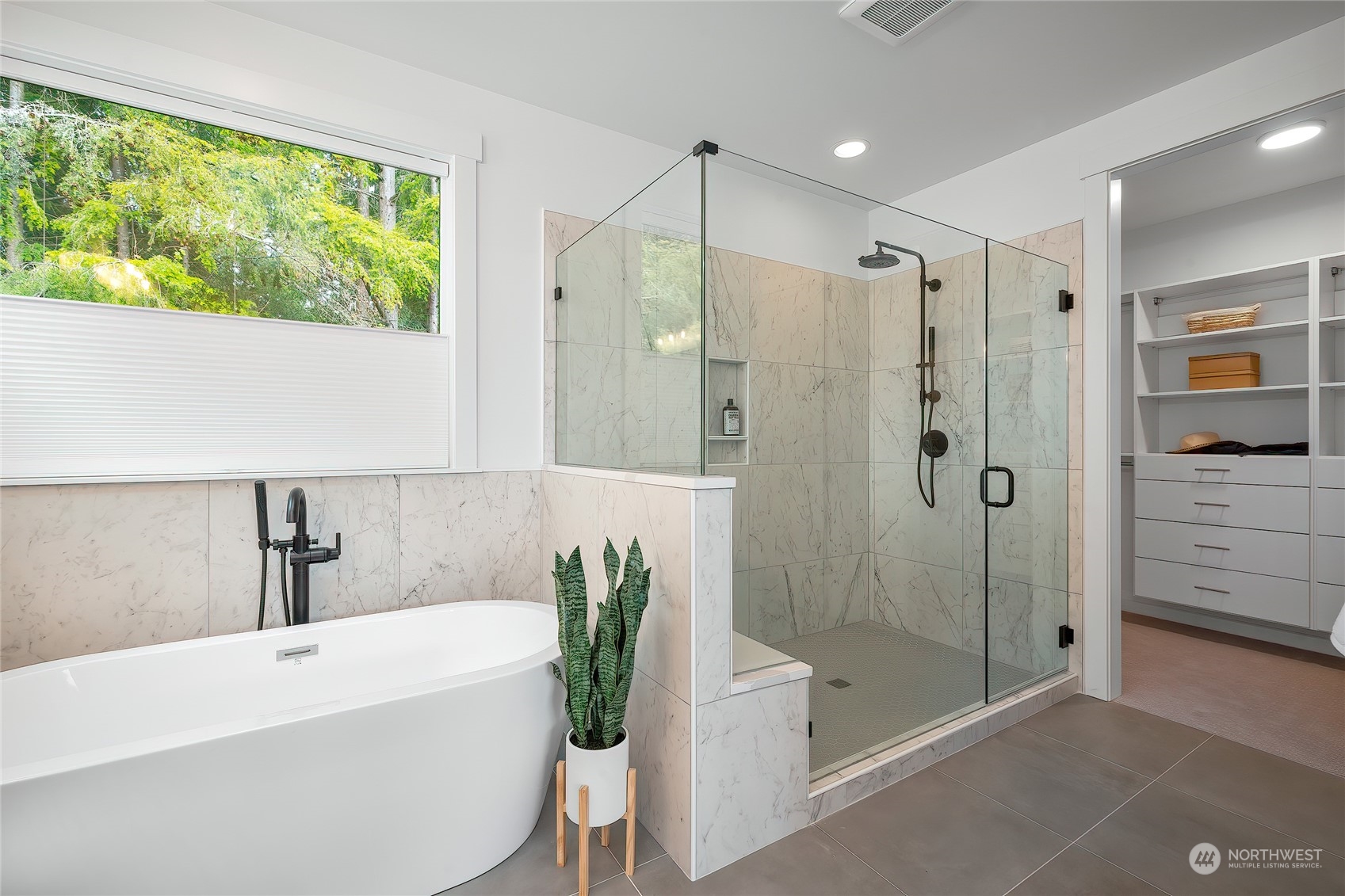 309 174th Street Southeast Bothell, WA 98012 - Photo 27 of 35 a bathroom with a tub shower and sink