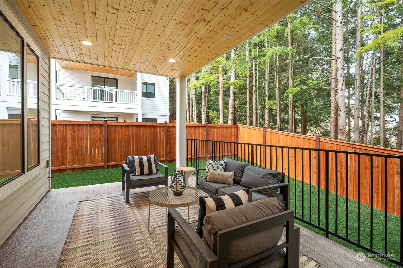 309 174th Street Southeast Bothell, WA 98012 - Photo 33 of 35 a view of a patio with couches chairs potted plants and wooden floor