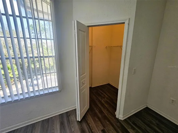 a bathroom with a sink a toilet and shower curtain