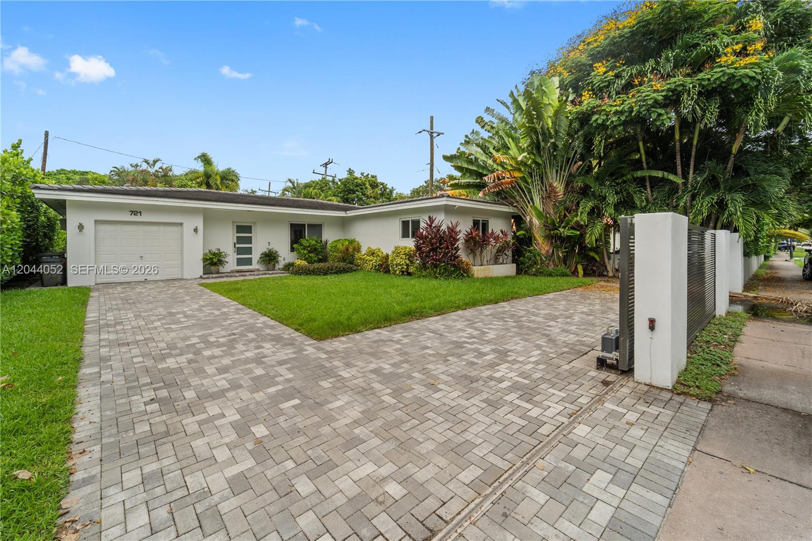 721 Bird Road Coral Gables, FL 33146 - Photo 21 of 24 a view of a house with a yard and road