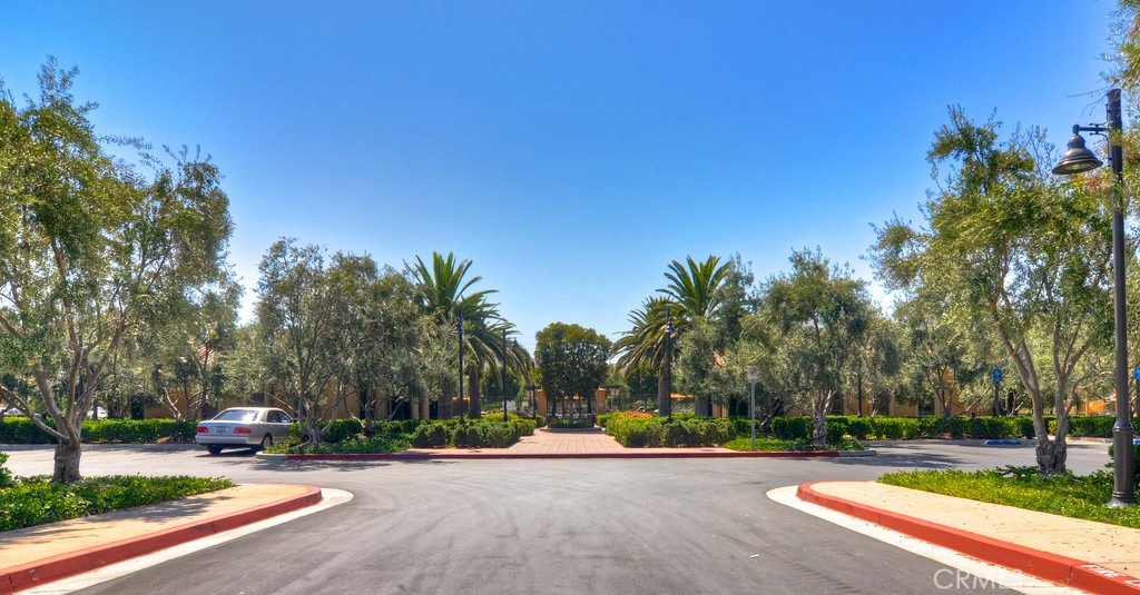 75 Bianco Irvine, CA 92618 - Photo 9 of 37 a view of a street with a building and trees in the background