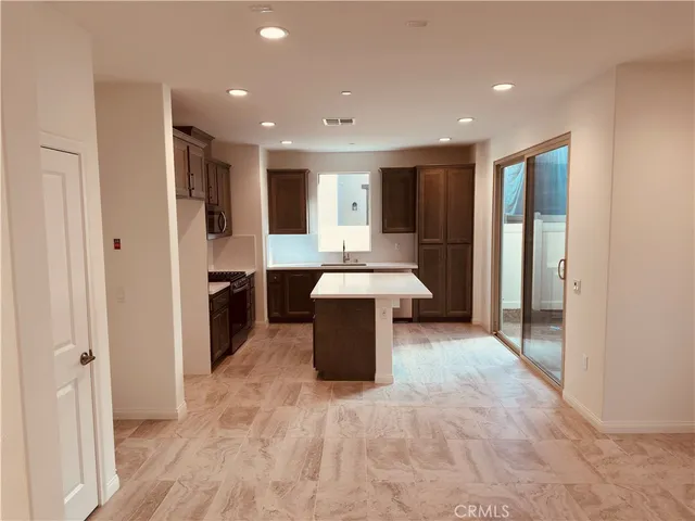 a kitchen with a sink and a stove top oven