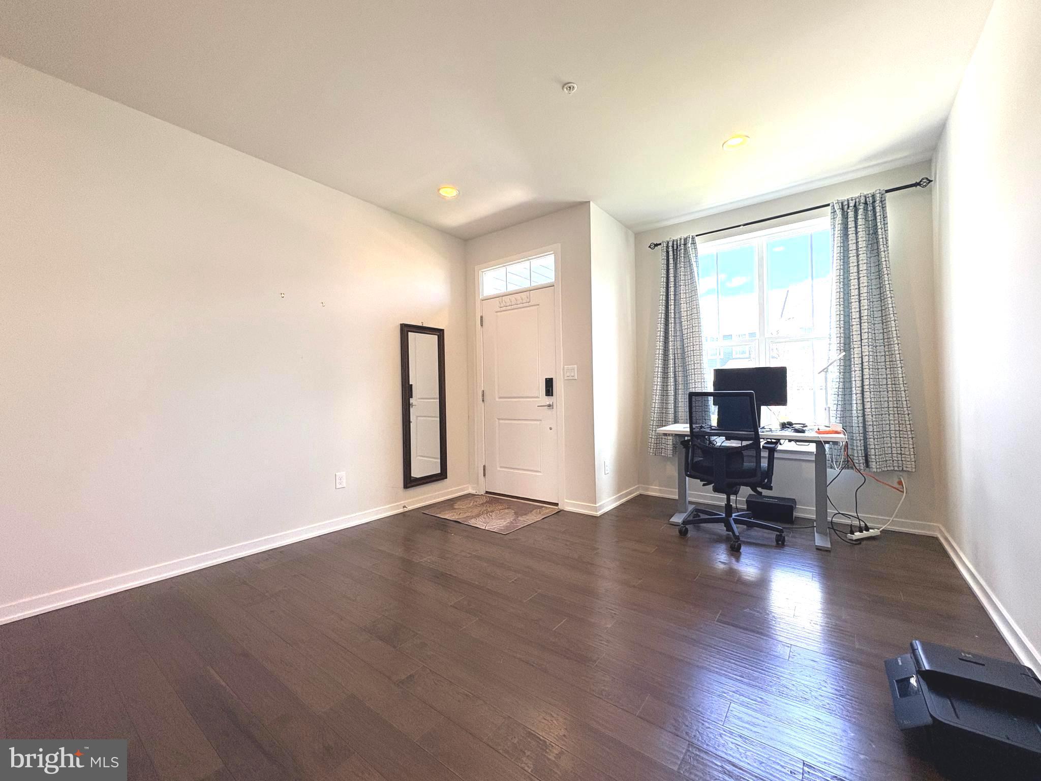 113 Wynstone Court Colmar, PA 18915 - Photo 3 of 20 a view of a livingroom with workspace and a window