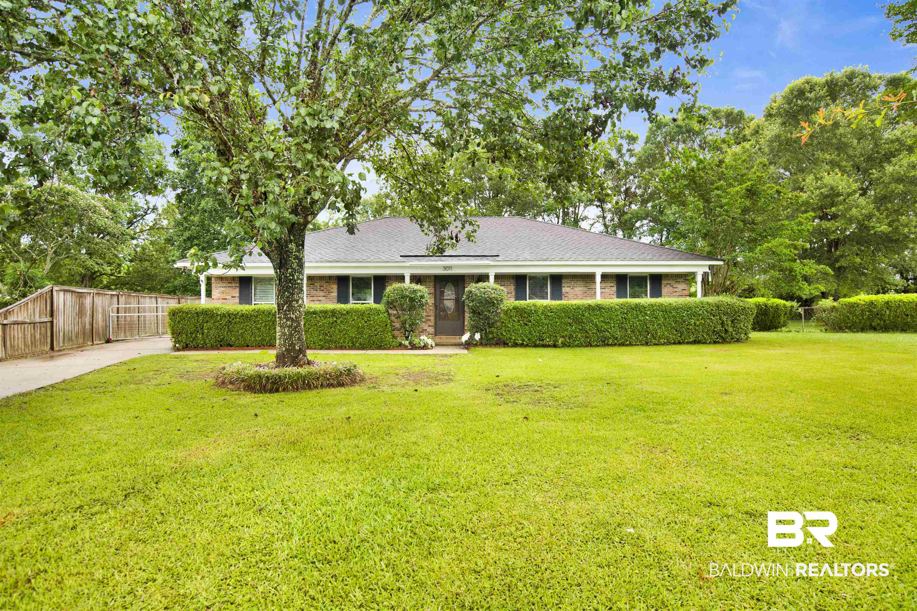 3011 Olde Gate Road Mobile, AL 36695 - Photo 3 of 35 Single story home with brick siding, driveway, and a shingled roof