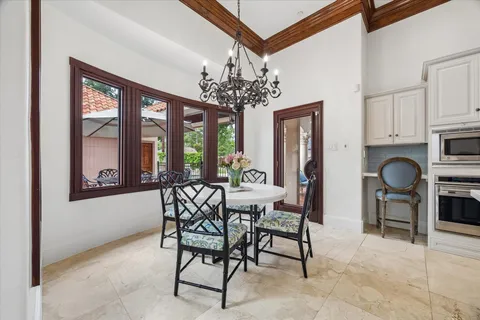 a kitchen with stainless steel appliances granite countertop a sink refrigerator and cabinets