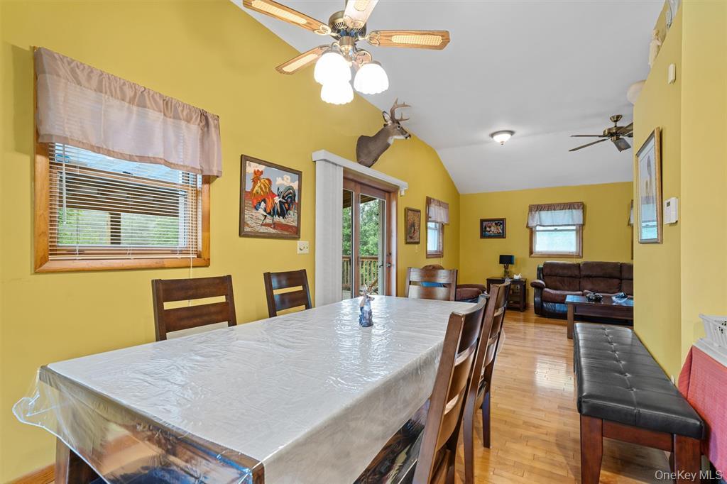 1013 Cooley Road Parksville, NY 12768 - Photo 11 of 44 a view of a dining room with furniture window and wooden floor