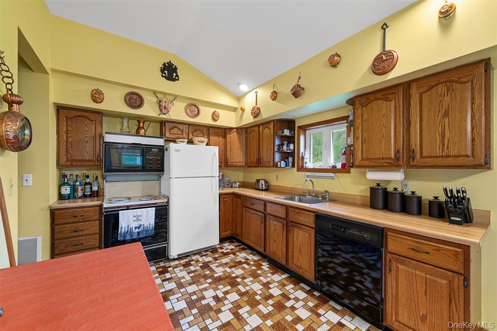 1013 Cooley Road Parksville, NY 12768 - Photo 13 of 44 a kitchen with stainless steel appliances granite countertop a sink and cabinets