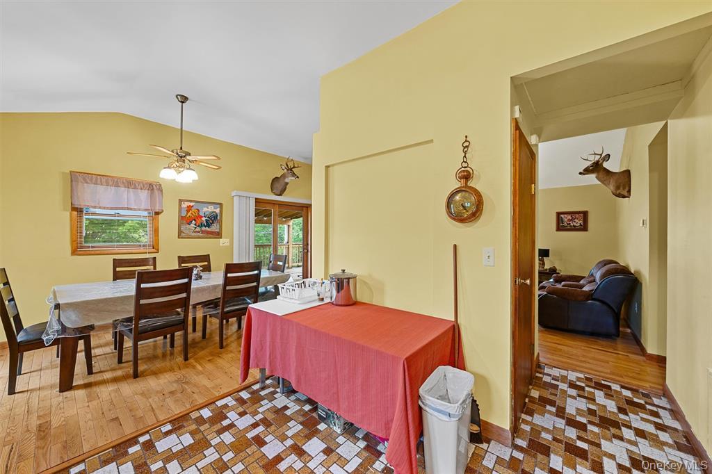 1013 Cooley Road Parksville, NY 12768 - Photo 15 of 44 a bedroom with furniture and a chandelier