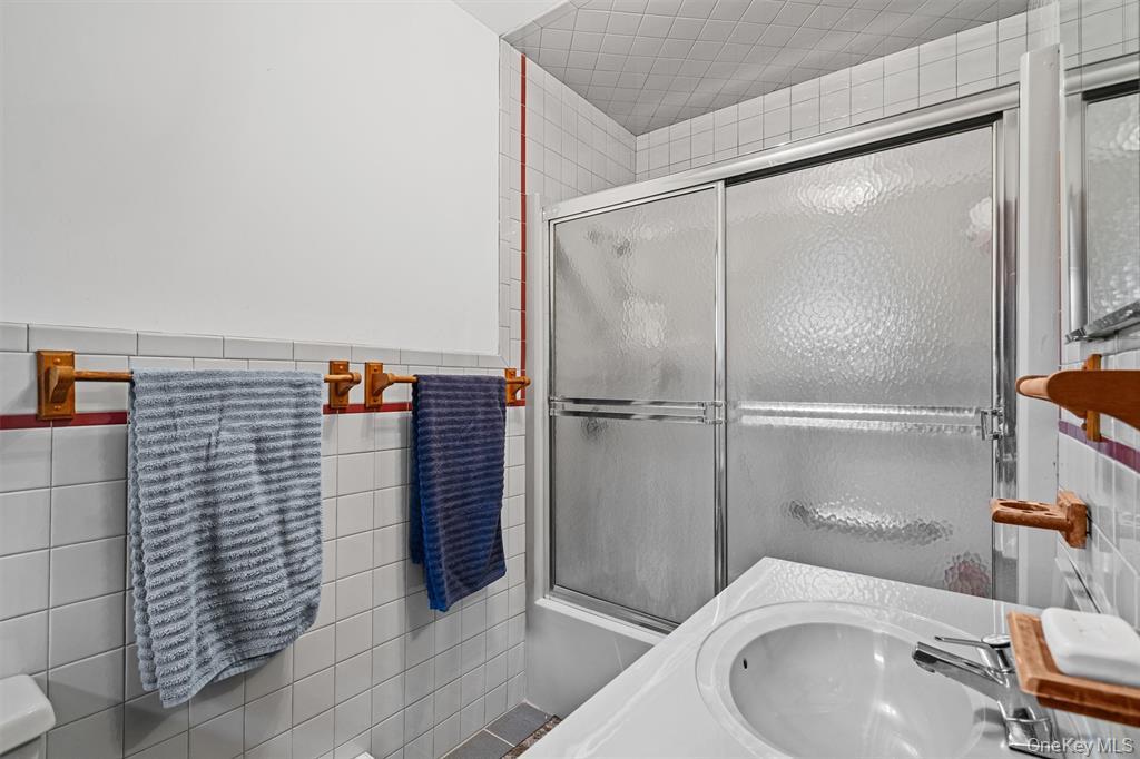 1013 Cooley Road Parksville, NY 12768 - Photo 19 of 44 a bathroom with a sink and mirror