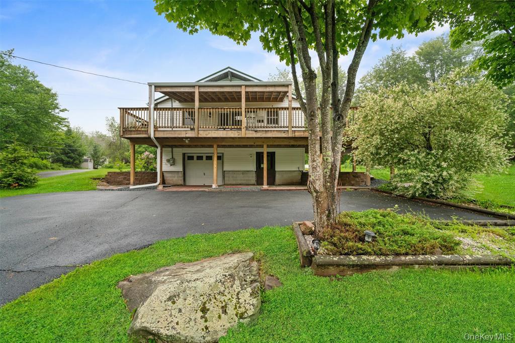 1013 Cooley Road Parksville, NY 12768 - Photo 2 of 44 a front view of a house with a yard