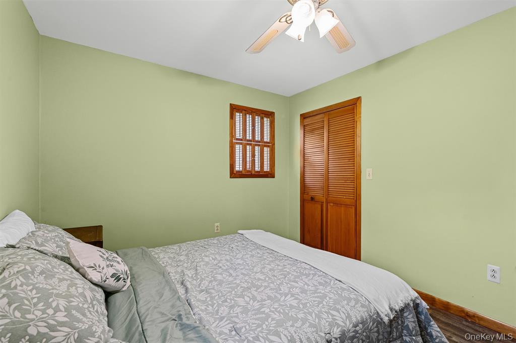 1013 Cooley Road Parksville, NY 12768 - Photo 21 of 44 a bedroom with a bed and a window