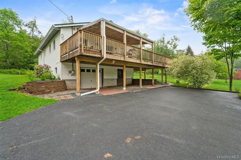 1013 Cooley Road Parksville, NY 12768 - Photo 22 of 44 a view of a large house with a street
