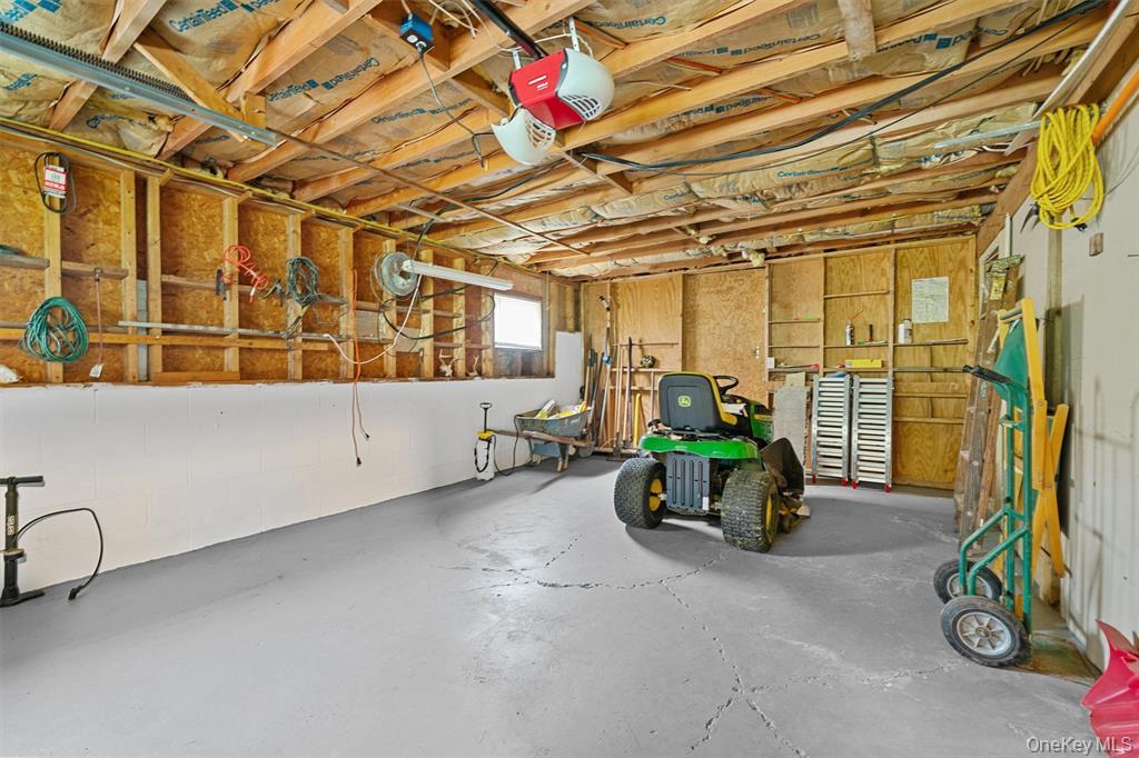 1013 Cooley Road Parksville, NY 12768 - Photo 27 of 44 a car and bike parked in a garage
