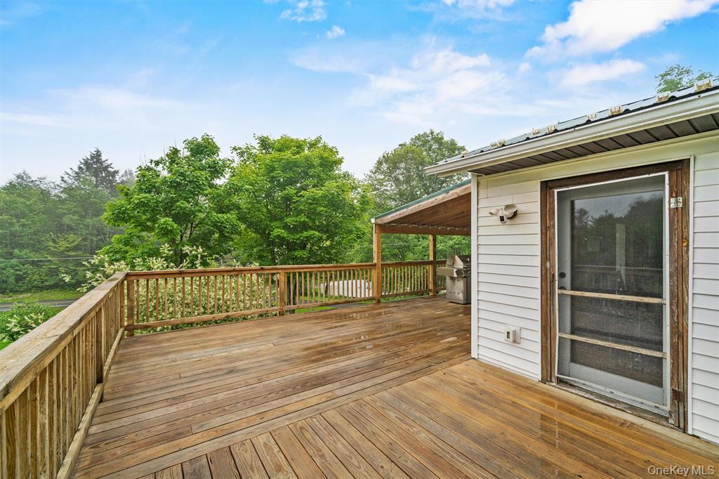 1013 Cooley Road Parksville, NY 12768 - Photo 32 of 44 a view of balcony with wooden floor and fence